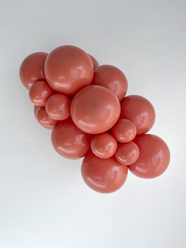 11" Tuftex Rojo - Paquete de 100